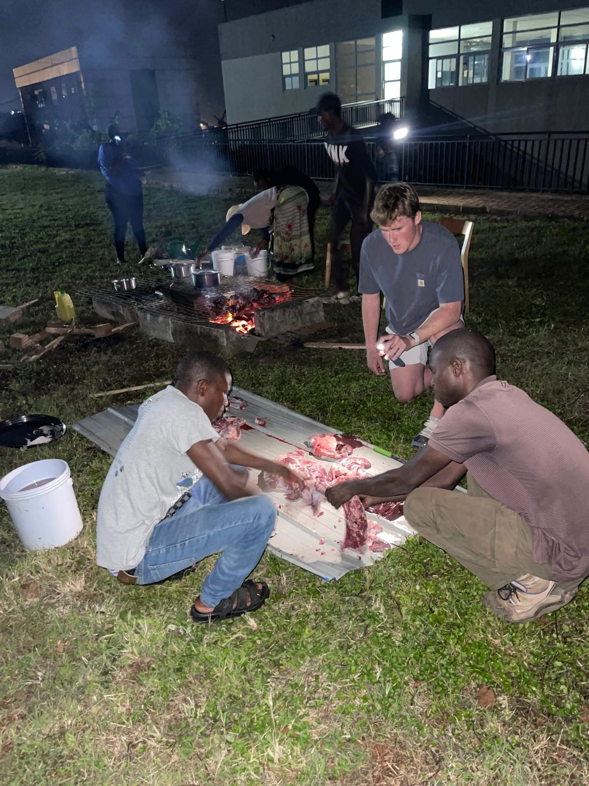 Coach Jack learns to roast a goat in Karongi