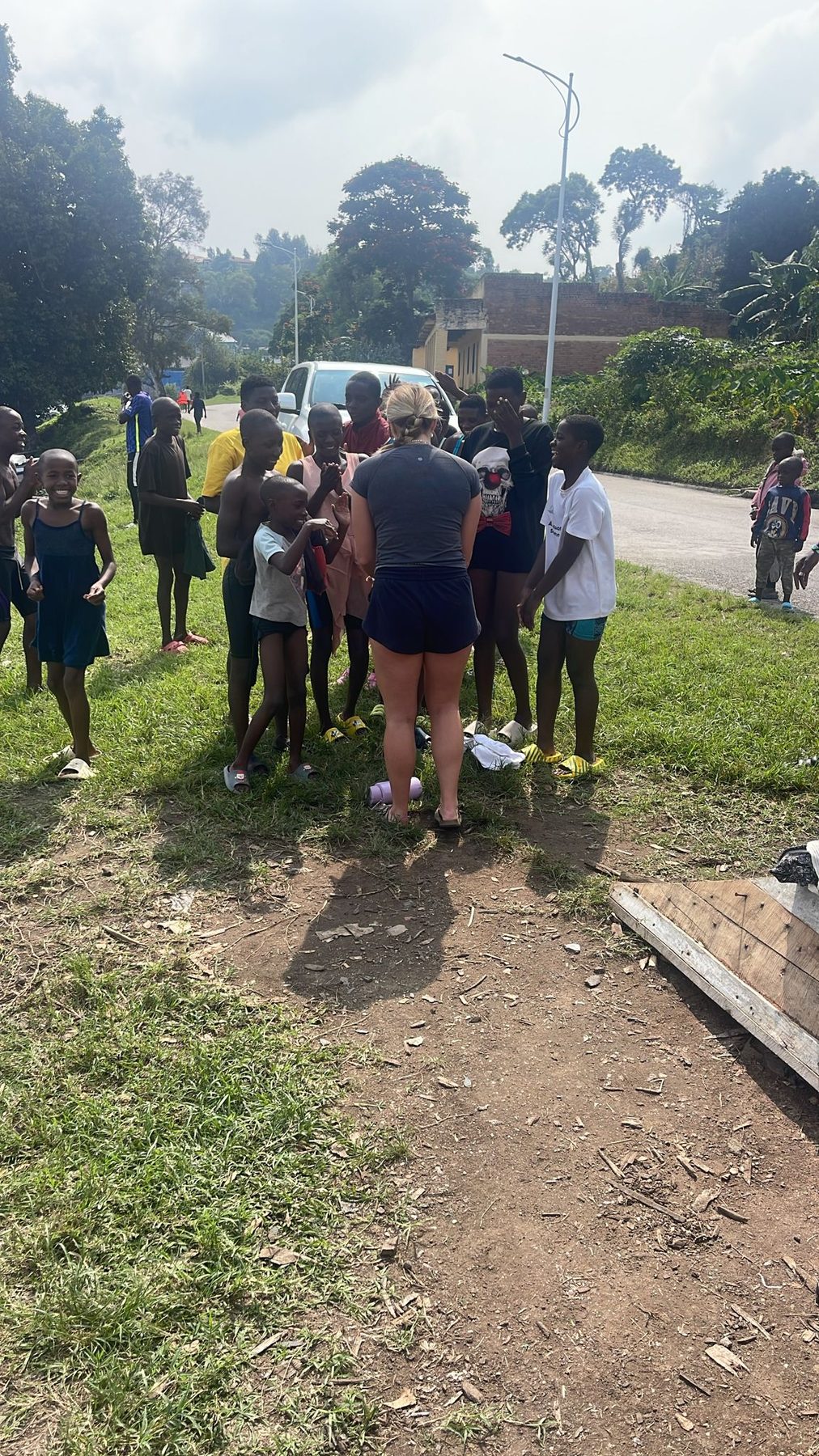 Coach Delia warms up with Karongi swimmers