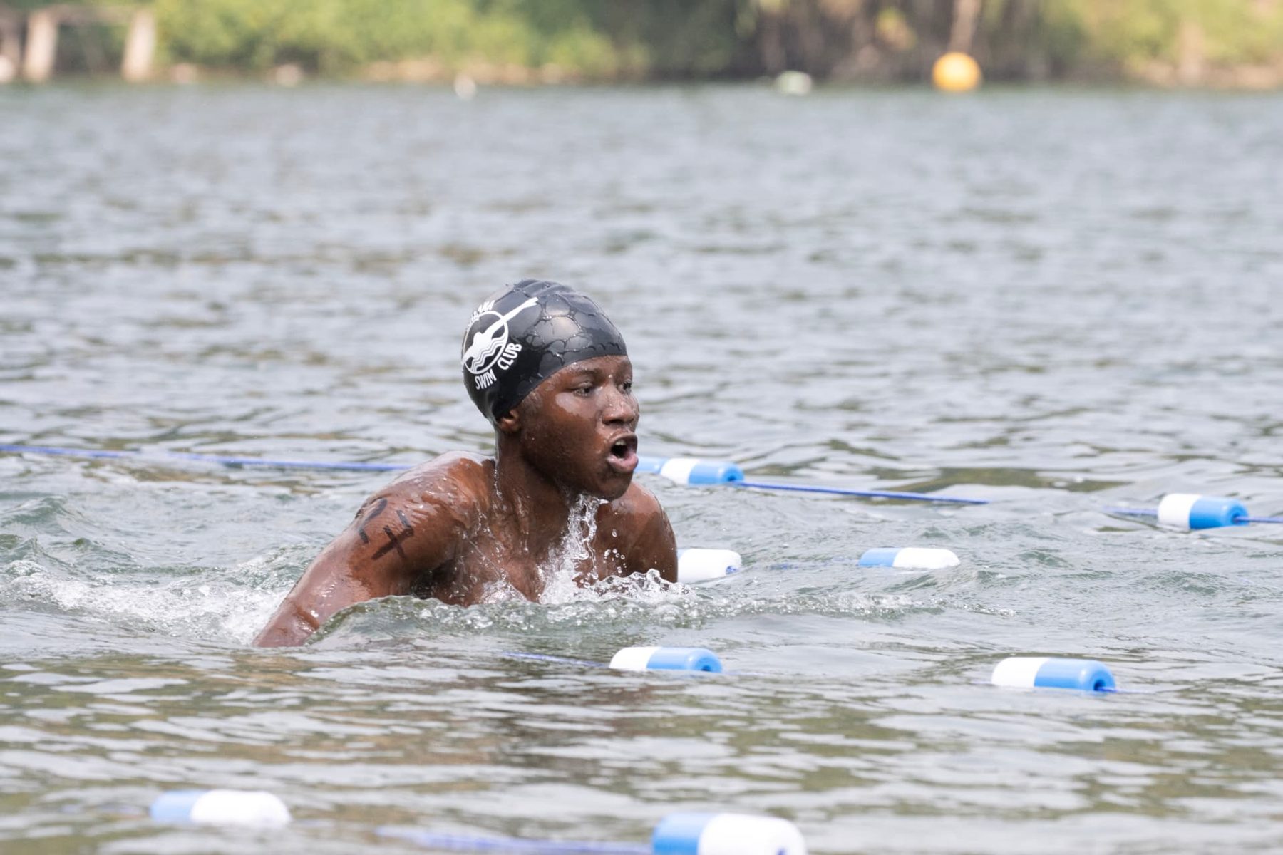 Numbered swimmer in breaststroke