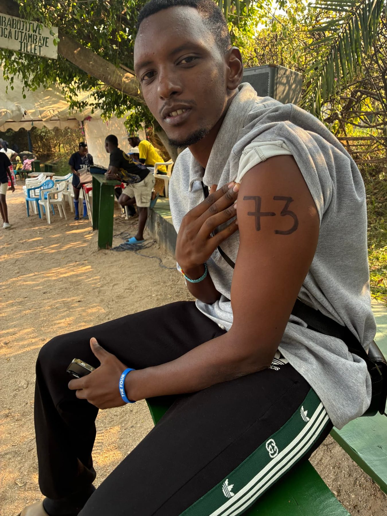 Another swimmer gets a race number